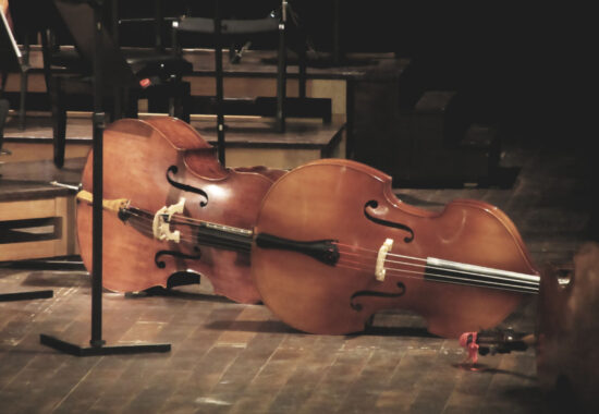 Cello music instruments on stage in concert hall