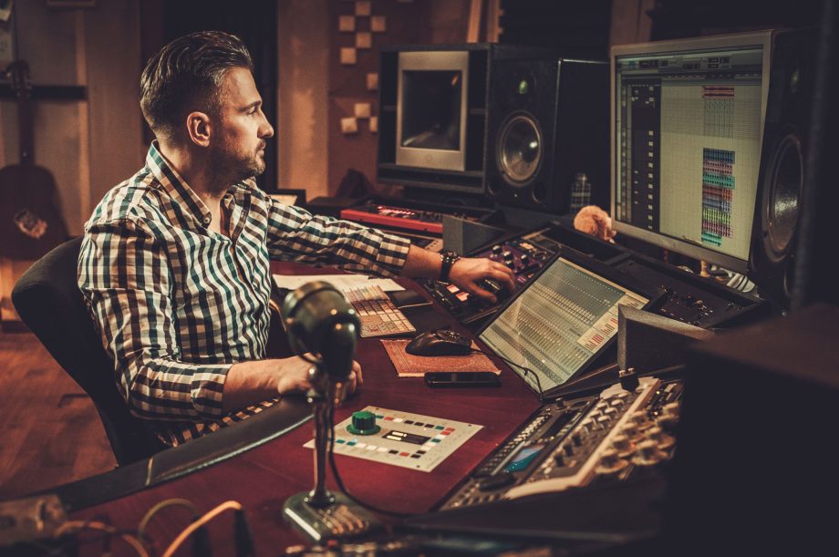 Sound engineer working in boutique recording studio